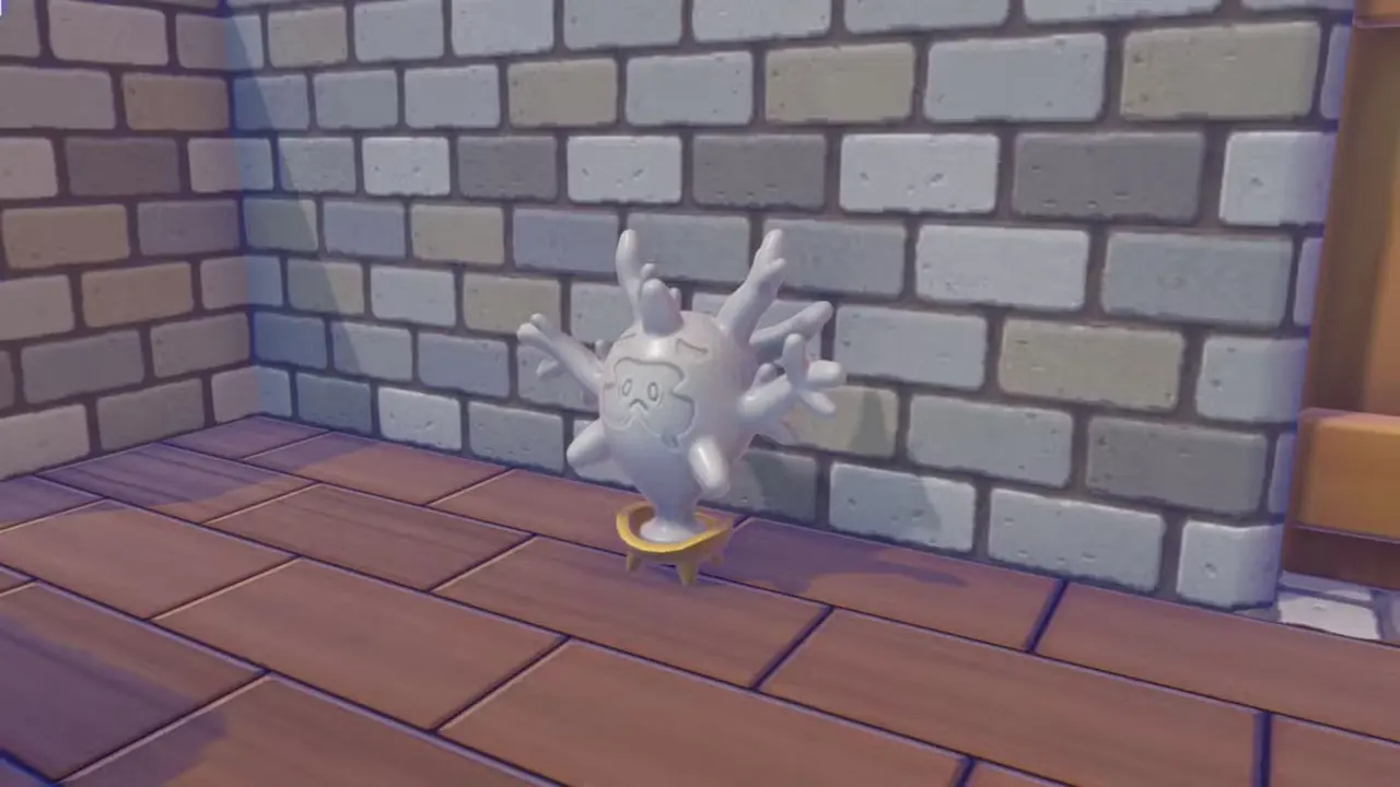 A Pokémon Pokopia screenshot showing the cursola statue