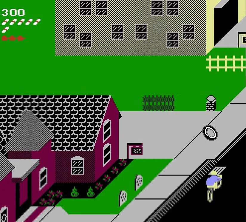 In the Paperboy demo, the paperboy rides down the street past a non-subscriber's red house as an inner-tube rolls along the sidewalk.
