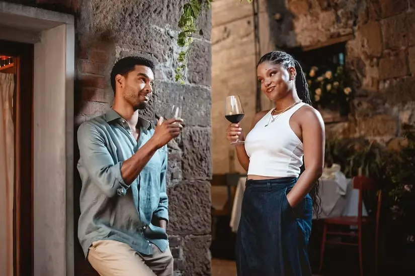 A man and a woman drinking wine in 'You, Me & Tuscany)