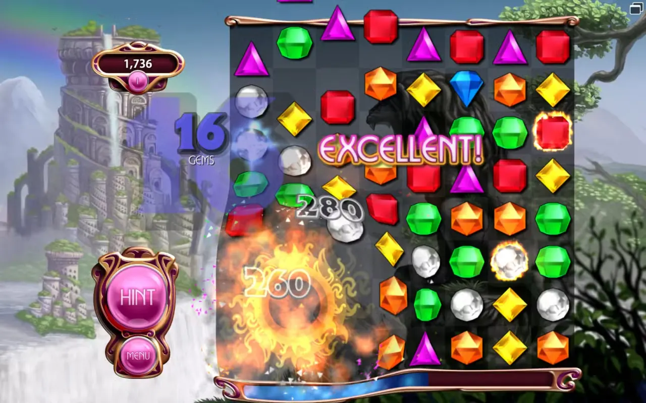 An explosion on a board of gems in Bejeweled, with the word EXCELLENT across it