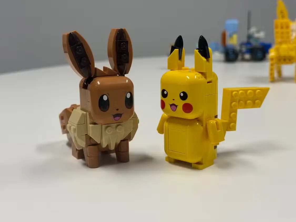 Eevee and Pikachu Smart Play toys sit next to each other.