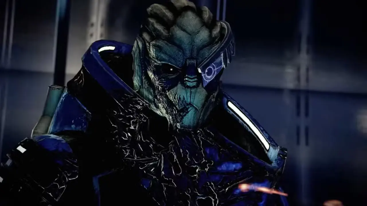 A close-up of Garrus, an alien from Mass Effect, wearing blue armor and a visor over one eye.